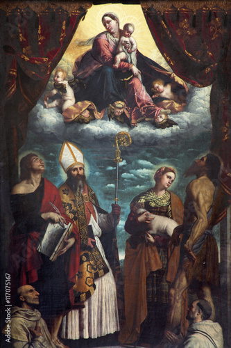 BRESCIA, ITALY - MAY 23, 2016: The painting of Madonna among the saitns in church Chiesa di San Giovanni Evangelista by by Alessandro Bonvicino - Moretto (1498 - 1554). © Renáta Sedmáková