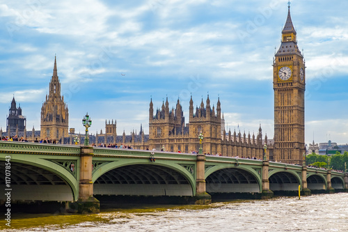 LONDON - JUNE 29, 2014  :  Visitors are walking on the westminster bridge taking their trevel moment for the Big Ben, the famous landmark in London. photo