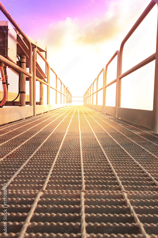 Fototapeta premium Walk way boom flare oil and gas offshore field at well head remote platform.