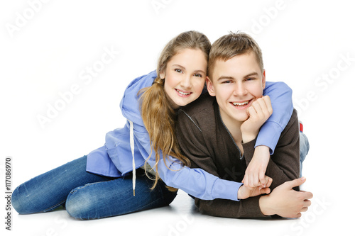 Teenage boy and girl isolated on white