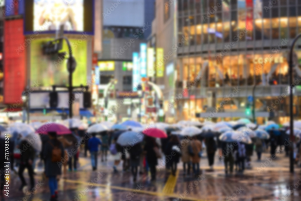 rainny day crowded street in Tokyo, blurred background