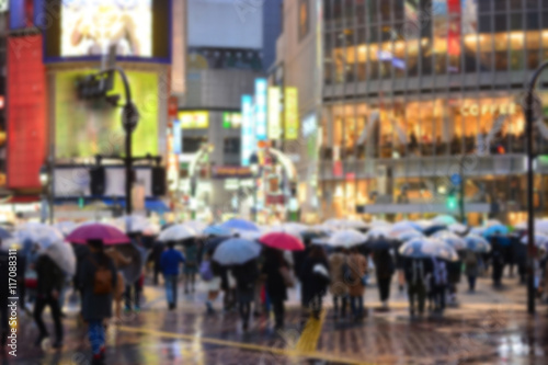 rainny day crowded street in Tokyo, blurred background © iamtui7