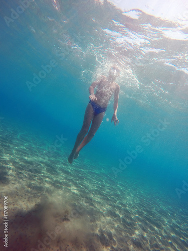 man dives into the sea