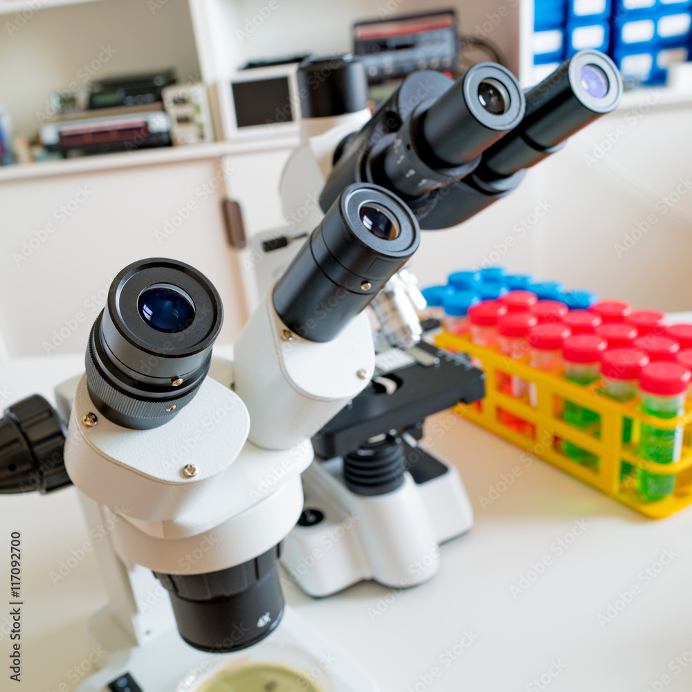 Science microscope on lab bench. Microbiology laboratory. Water