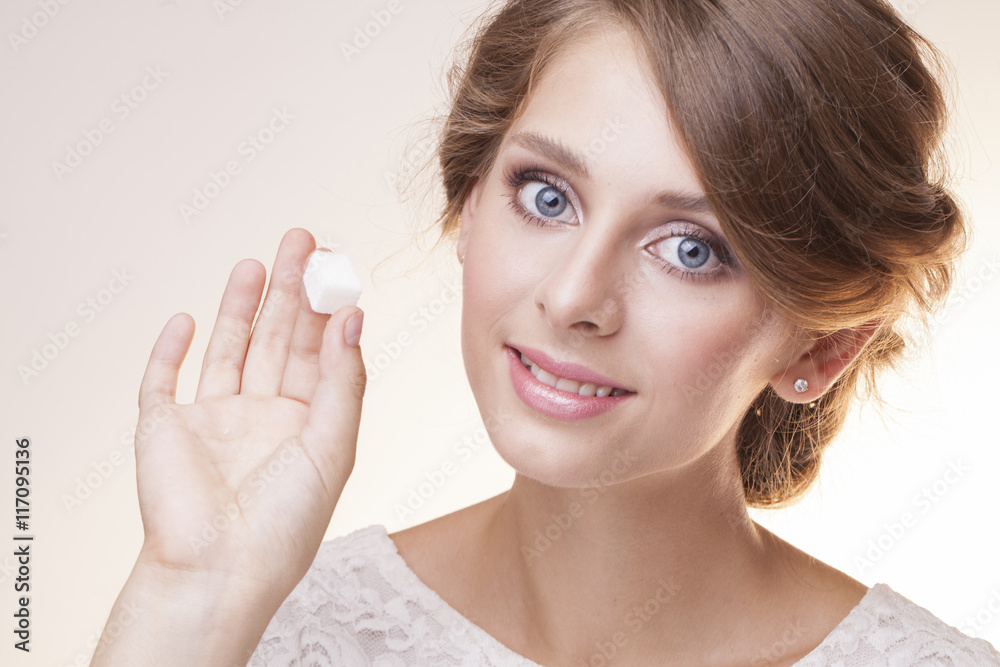 pretty girl with refined sugar in the fingers pretty girl with refined sugar in the fingers