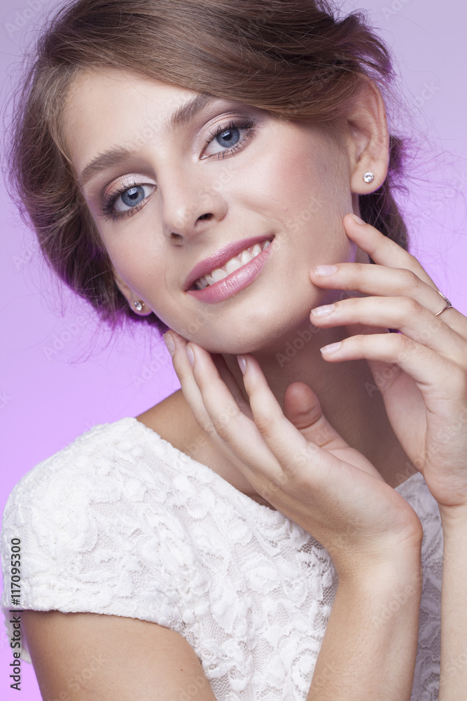 pretty smiling girl with hand next to face on the pink background pretty smiling girl with hand next to face on the pink background