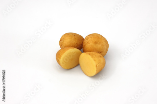 whole and sliced potatoes isolated