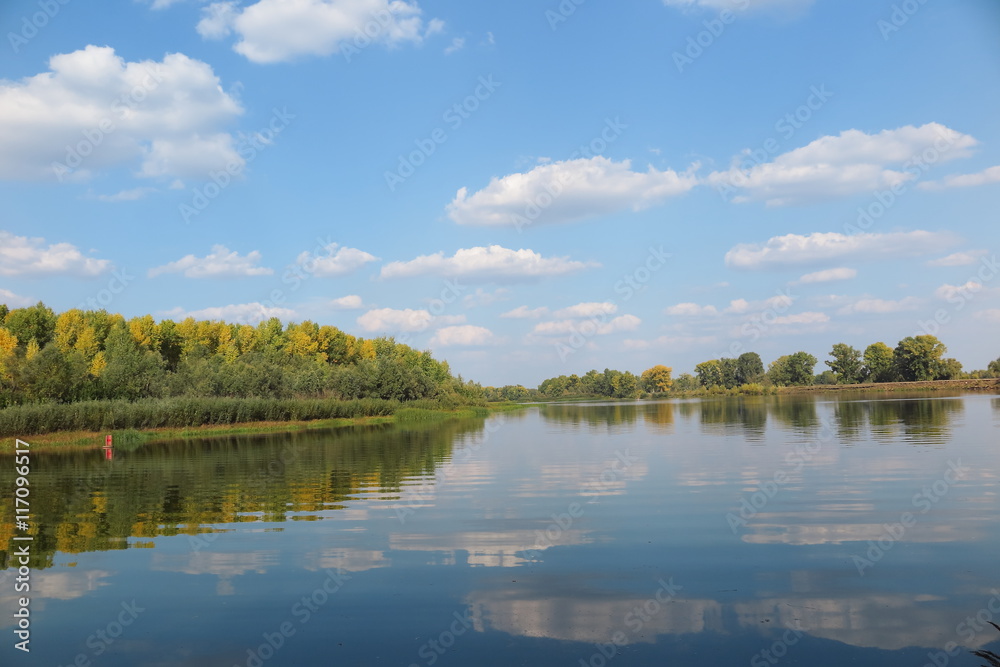 September river against a blue sky