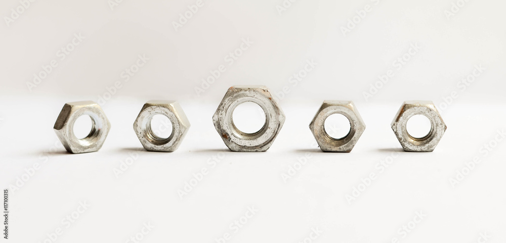 Metal nuts isolated on the white background Metal nuts isolated on the white background