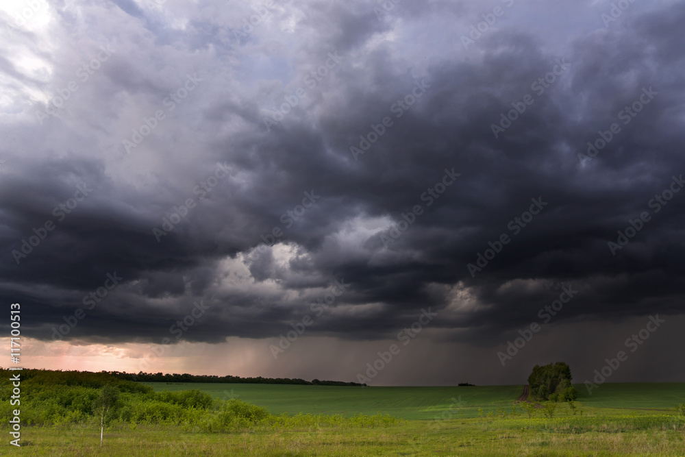 Thunder-storm over fields in rural areas Thunder-storm over fields in rural areas