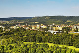 sunny morning on a hill Bystricky kopec with view to Kadan town and Uhost mountain on the horizon in czech republic