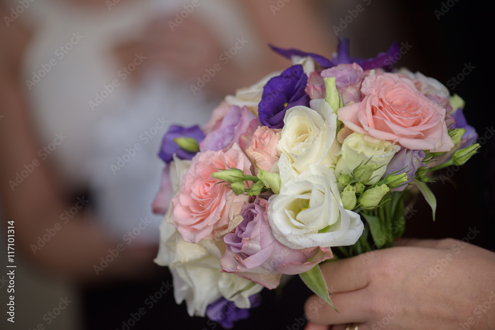 Bridesmaid showing her bouquet