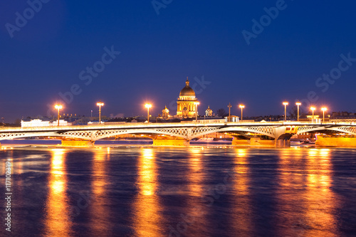 Blagoveshchensky (Leuteinant Schmidt) bridge and St. Isaac Cathedral in St.Petersburg, Russia. White night view from embankment.