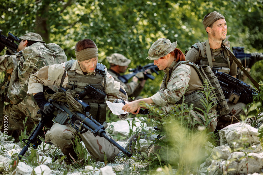 Special forces soldiers with weapon take part in military maneuv Special forces soldiers with weapon take part in military maneuv