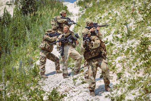 Special forces soldiers with weapon take part in military maneuv