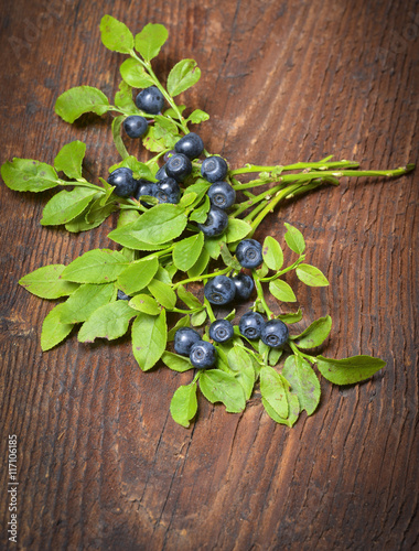 blueberries in the detail on a wooden table