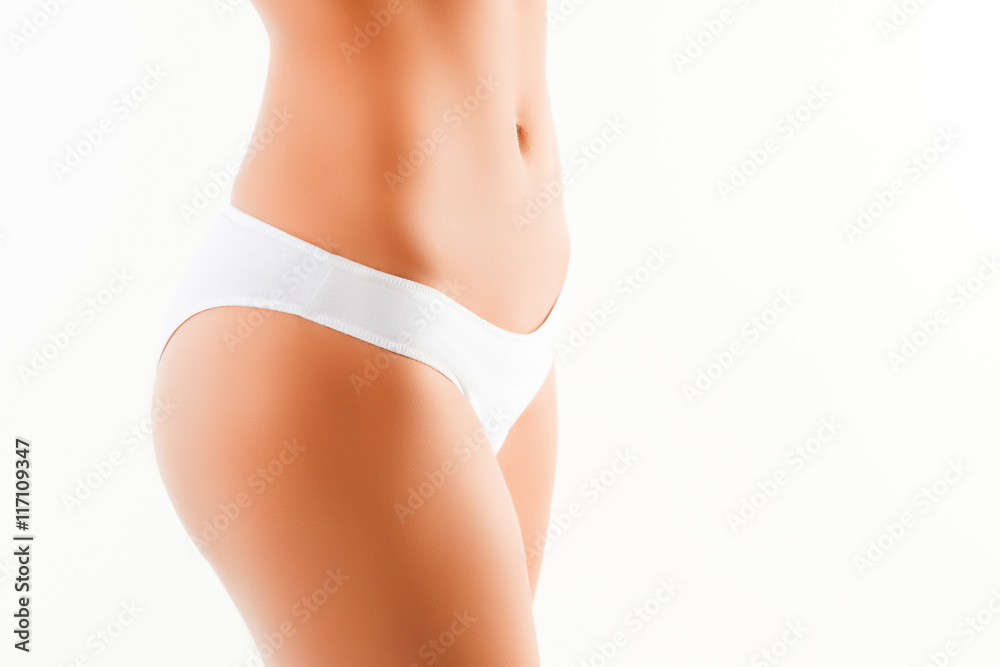 Side view of slim fit woman in white panties, close up photo Stock Photo
