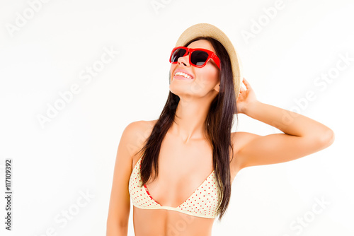 Portrait of happy smiling woman in summer hat and spectacles