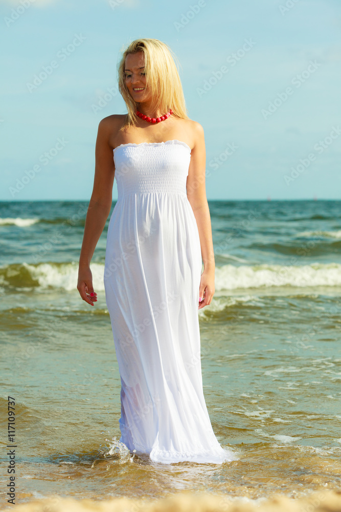 Attractive blonde woman on the beach.
