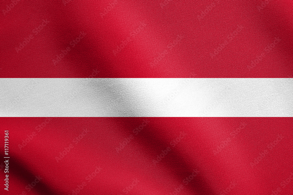 Flag of Latvia waving in wind with fabric texture Flag of Latvia waving in wind with fabric texture