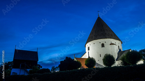 Round church in the town Olsker on Bornholm in Denmark by night, during Scandinavian white night
