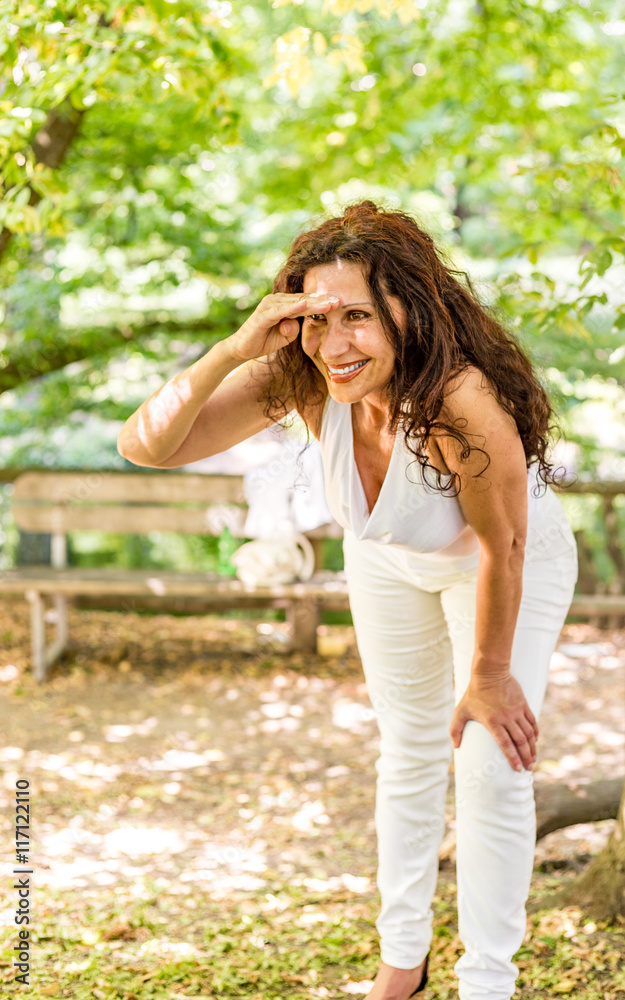 menopausal woman looks into the distance menopausal woman looks into the distance