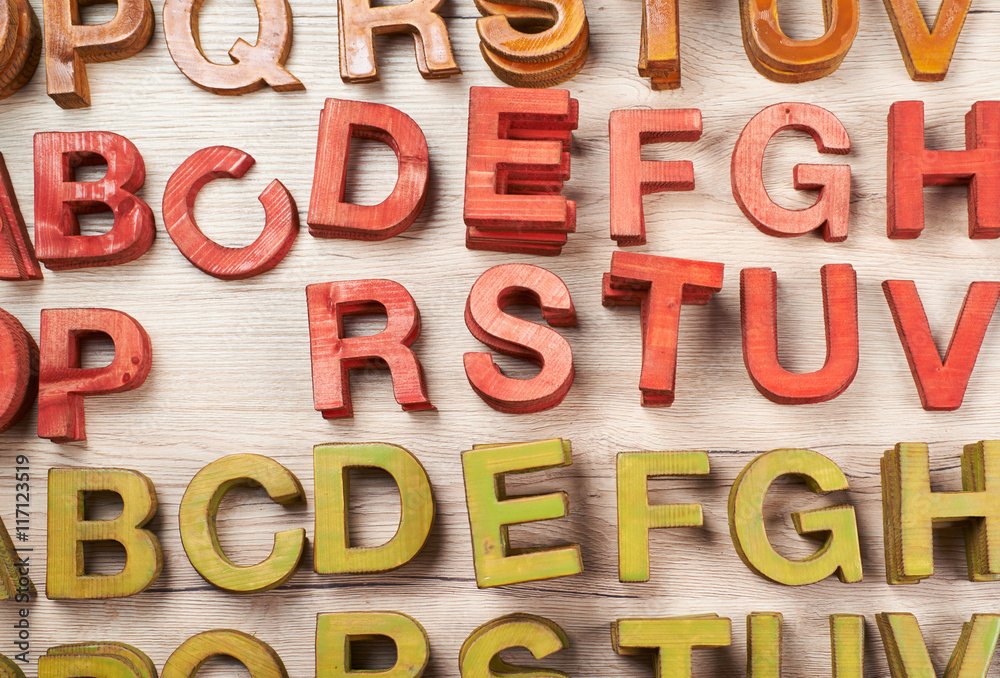 Surface coated with multiple wooden letters Surface coated with multiple wooden letters