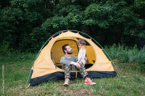 Dad and daughter rest in forest. Happy family, love, children sincere affection concept