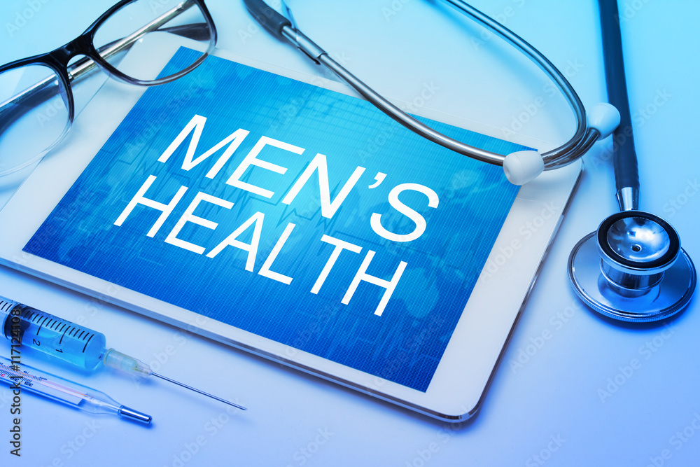 Men's health word on tablet screen with medical equipment on background