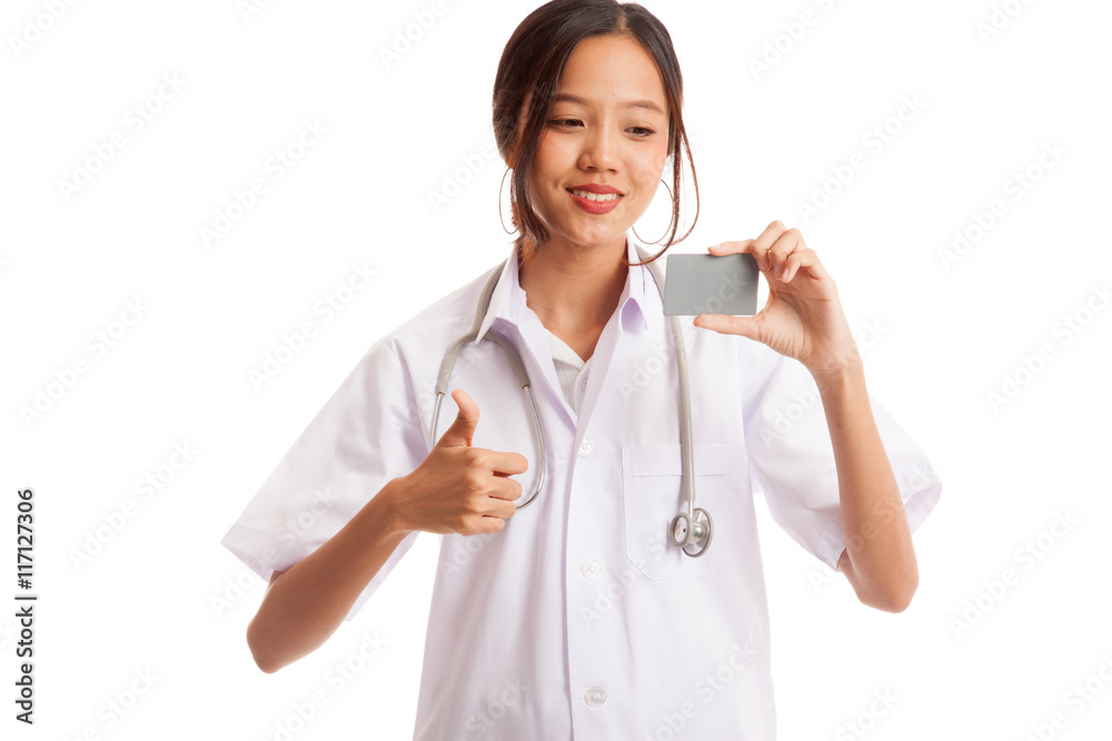 Asian young female doctor show thumbs up with blank card Asian young female doctor show thumbs up with blank card