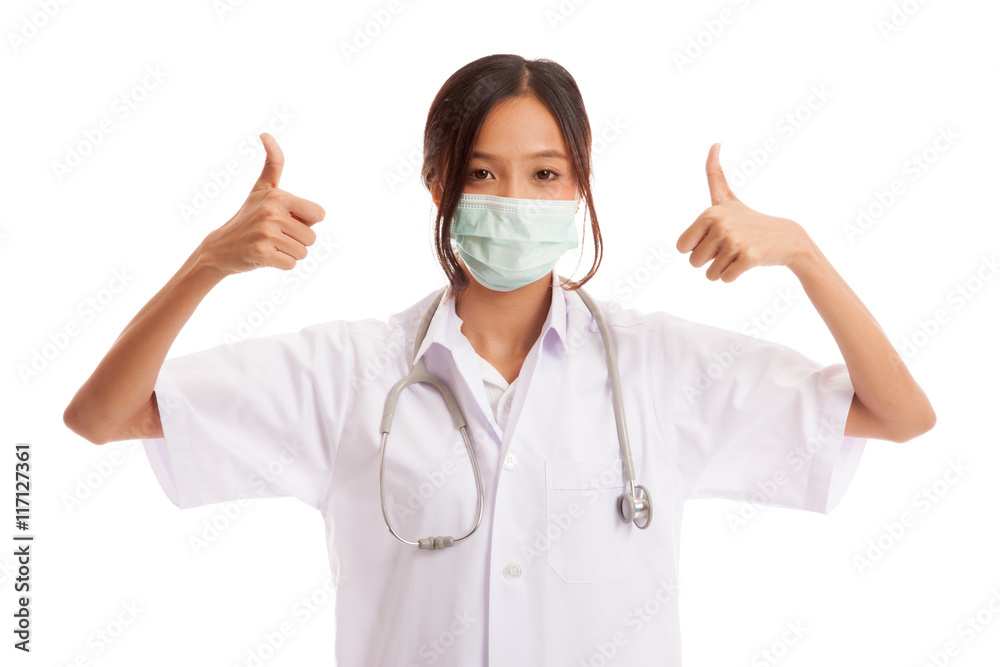 Young Asian female doctor thumbs up with both hands Young Asian female doctor thumbs up with both hands
