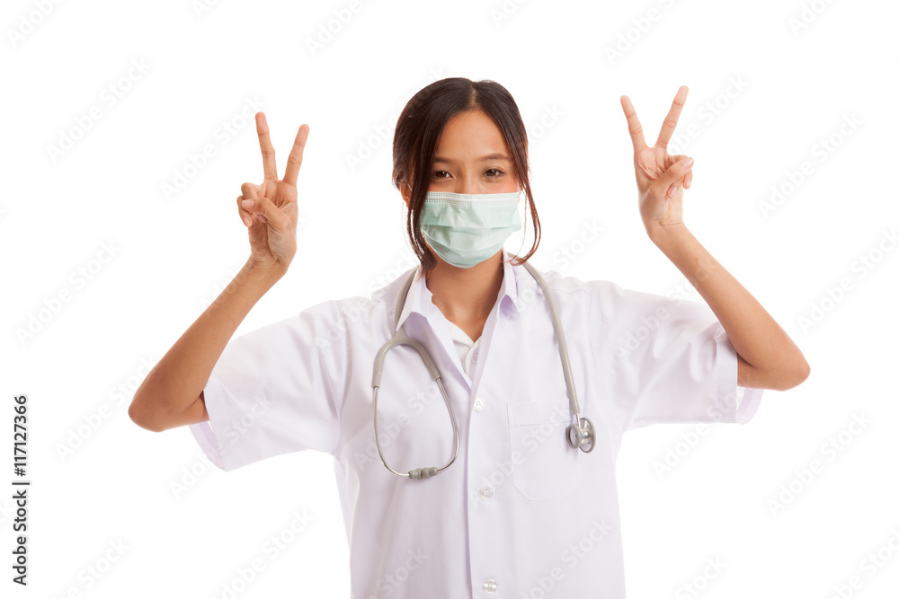 Young Asian female doctor show victory sign with both hands Young Asian female doctor show victory sign with both hands