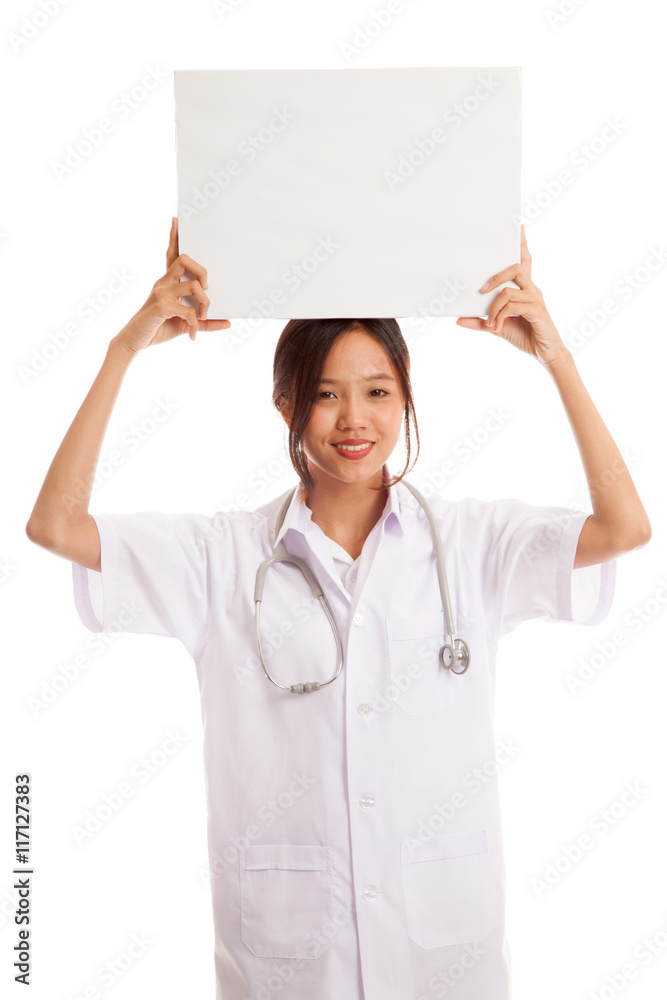Young Asian female doctor show a blank sign over head Young Asian female doctor show a blank sign over head