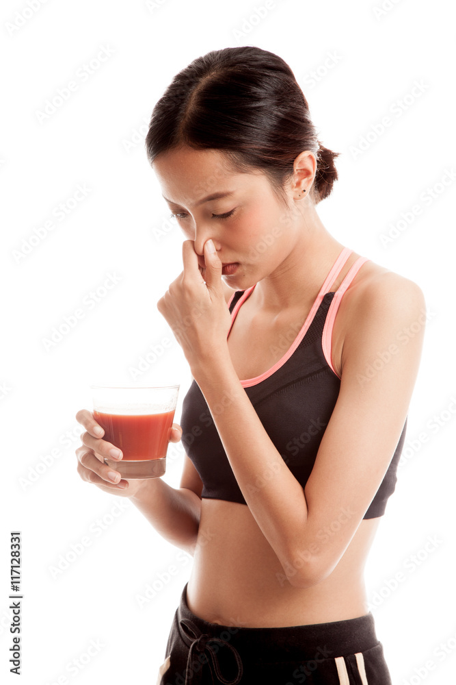 Beautiful healthy Asian girl hate tomato juice Beautiful healthy Asian girl hate tomato juice