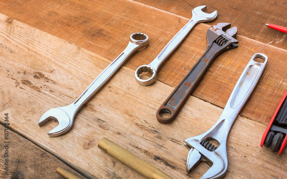 Wrench,flat crowbar,punch,Hex wrench on wood background. Wrench,flat crowbar,punch,Hex wrench on wood background.