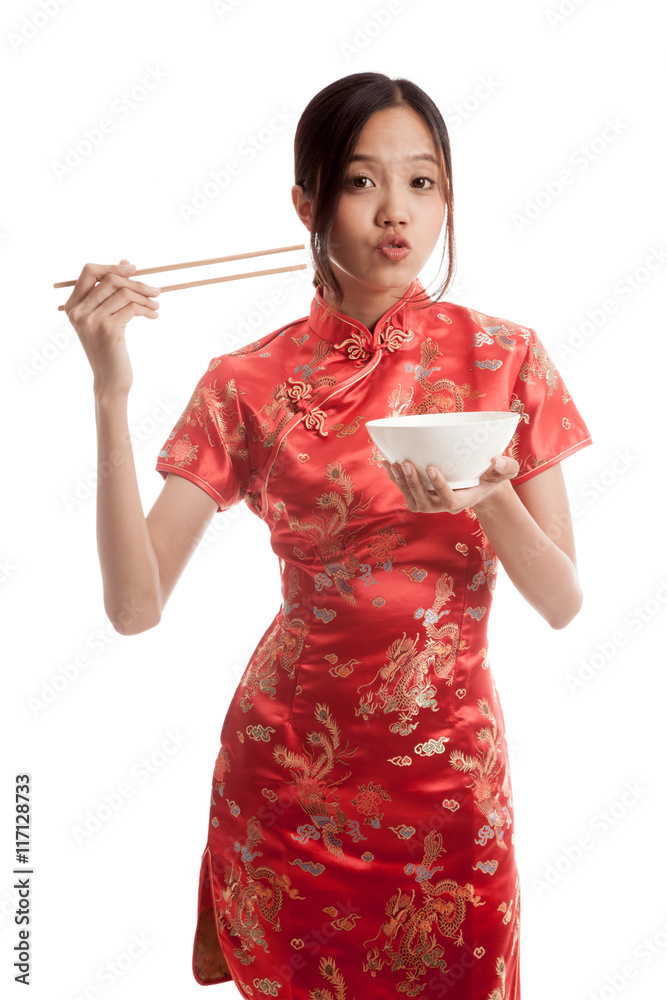 Asian girl in chinese cheongsam dress with chopsticks Asian girl in chinese cheongsam dress with chopsticks