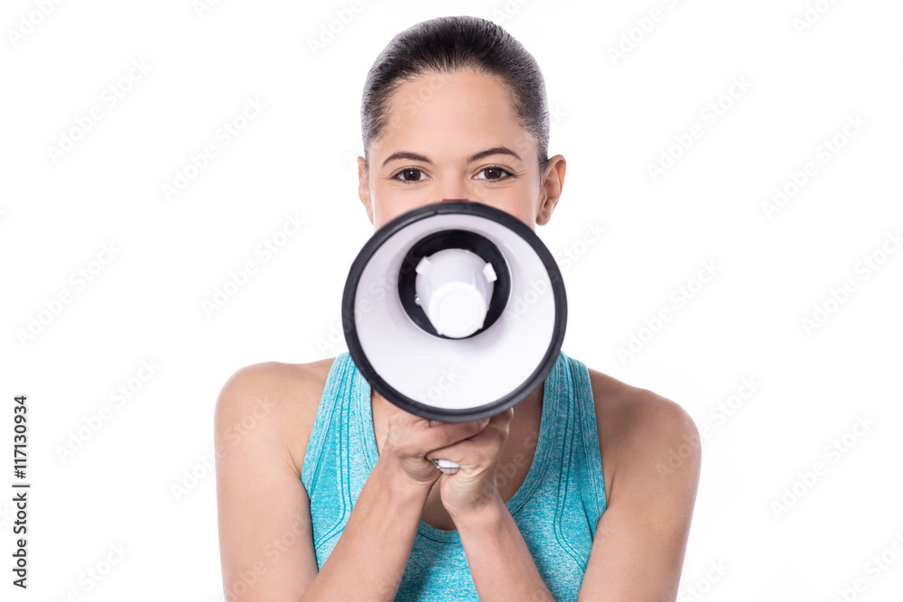 Fototapeta premium Fitness woman using a loudhailer