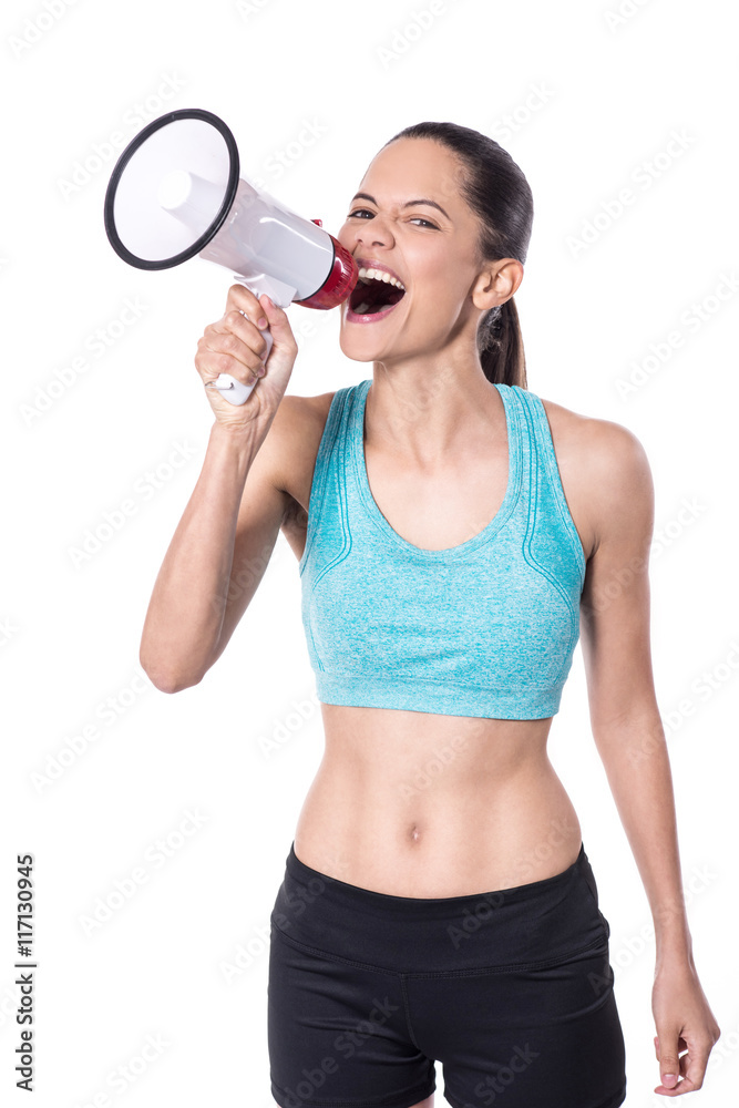 Fitness trainer making an announcement loudly Fitness trainer making an announcement loudly