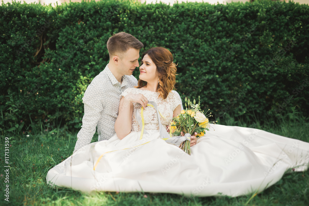 Beautiful, perfect couple posing on their wedding day Beautiful, perfect couple posing on their wedding day