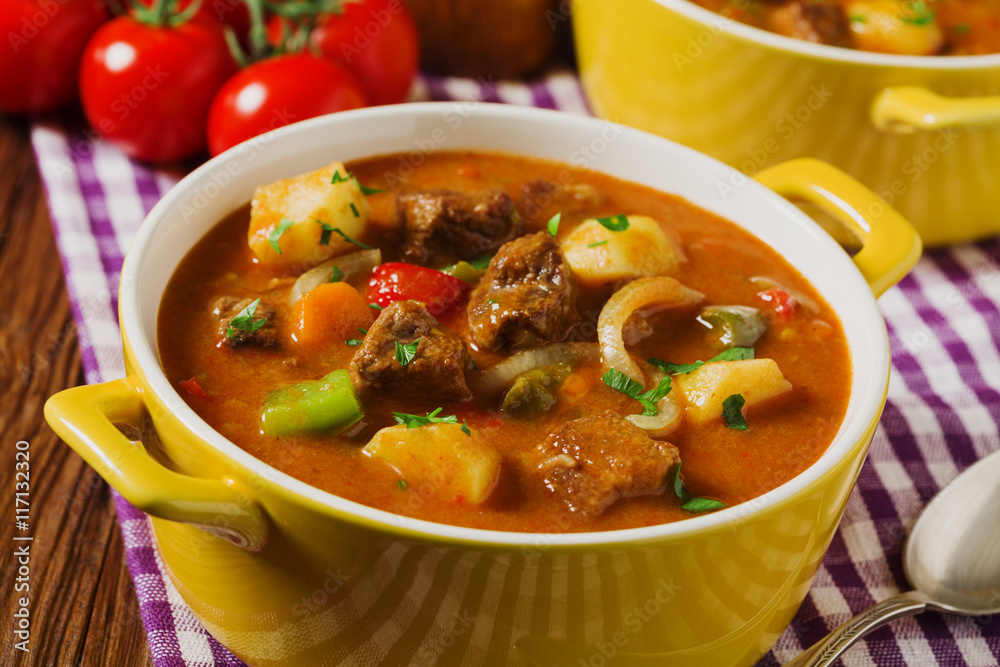 Beef stew served with cooked potatoes. Beef stew served with cooked potatoes.
