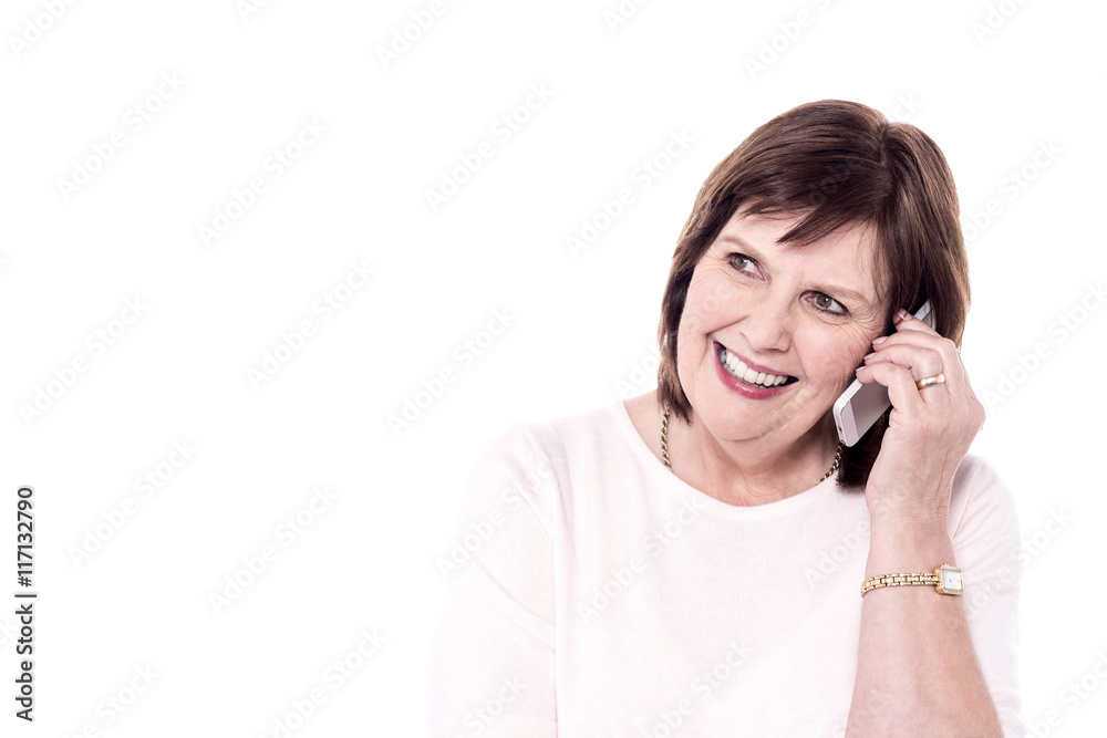 Cheerful senior woman speaking on phone Cheerful senior woman speaking on phone