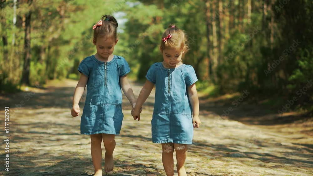 Two little girls walking in the woods Stock Video | Adobe Stock