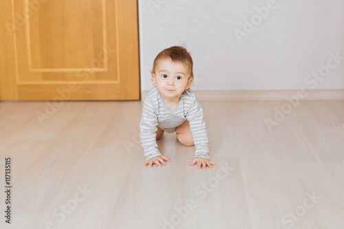Portrait of a crawling baby boy