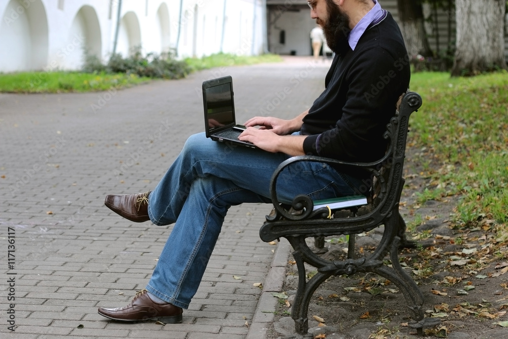 man reading books in the park man reading books in the park