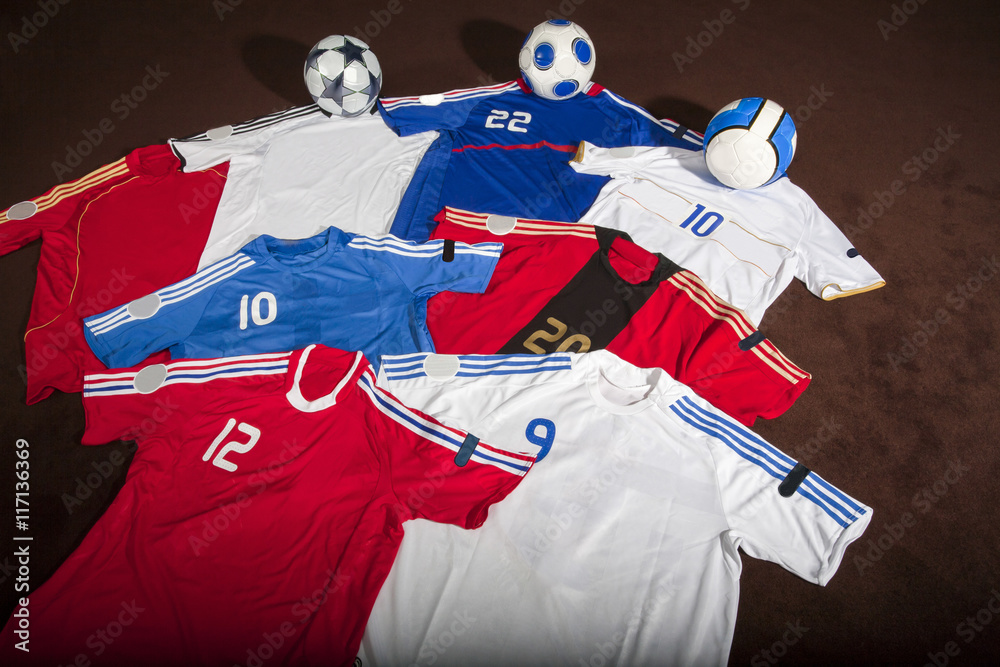 Naklejka premium Different team jerseys laid out on the floor