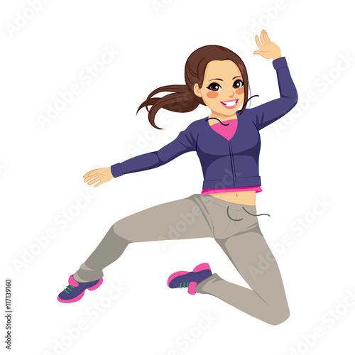 Beautiful brunette sporty dancing girl jumping