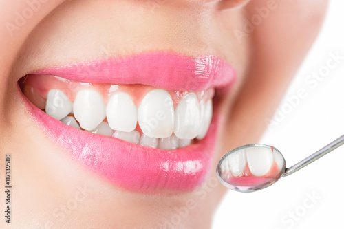 Close up young woman smiling white glamour teeth.