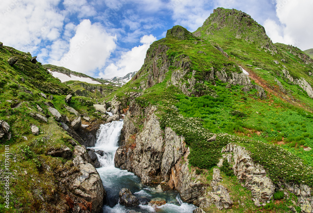 Summer mountain landscape with river and waterfall