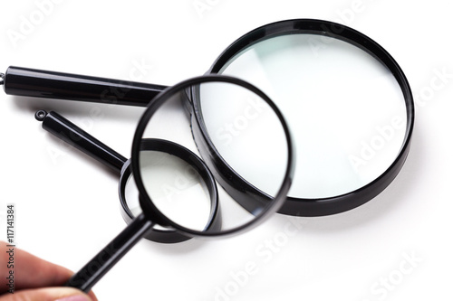 Three magnifiers over white