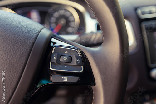 Modern car illuminated dashboard and steering wheel © fotofabrika